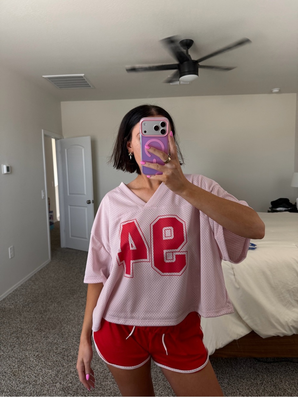 Pink and red cropped jersey